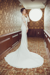Bride wearing long wedding dress.