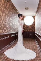 Bride wearing long wedding dress.