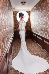 Bride wearing long wedding dress.