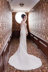 Bride wearing long wedding dress.