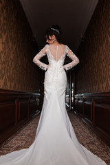 Bride wearing long wedding dress.