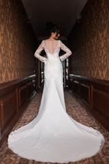 Bride wearing long wedding dress.