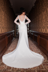 Bride wearing long wedding dress.