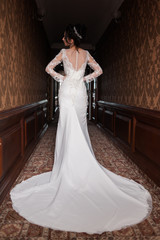 Bride wearing long wedding dress.