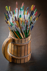Paint brushes and paints for drawing.
