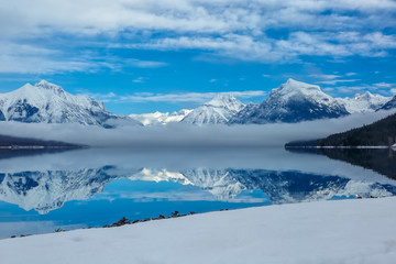 landscape of winter lake in fog, Lake McDonald, Glacier National Park, Montana