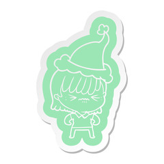 annoyed cartoon  sticker of a girl wearing santa hat
