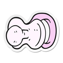 sticker of a cartoon pacifier