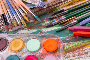 Paint brushes and paints for drawing.