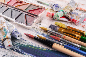 Paint brushes and paints for drawing.