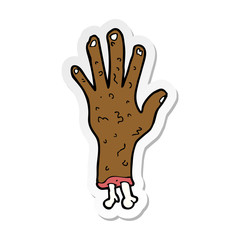 sticker of a gross zombie hand cartoon
