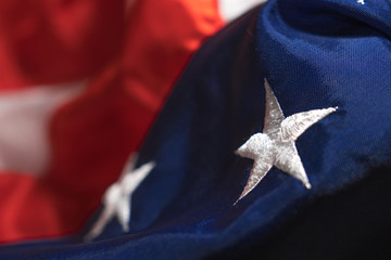 American flag textile closeup. Focus on star. USA symbology