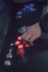woman in black dress on street of city at night