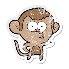 distressed sticker of a cartoon pointing monkey