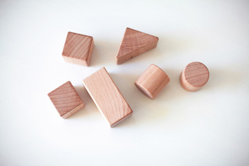 Wooden toy building blocks isolated on white