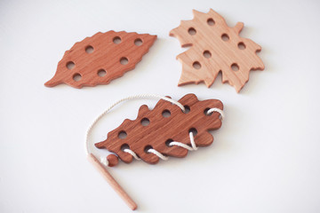 Wooden lacing toy with leaves shape
