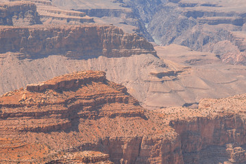 Closeup view on red rocks of Grand Canyon on sunny day