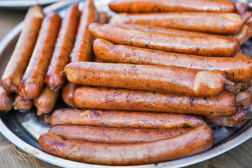 Street fast food grilled sausages closeup