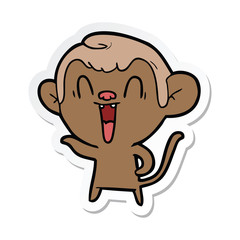 sticker of a cartoon laughing monkey