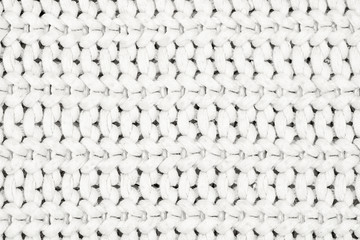 Real white knit texture. Background, pattern concept. Knitted fabric made of heathered yarn