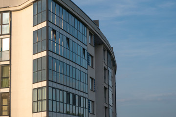 New apartment house on blue sky background. Accomodation concept