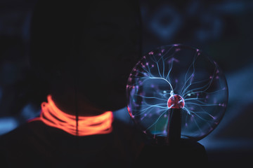 woman in black dress on street of city at night