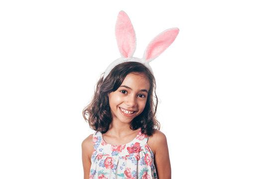 Studio shot of a happy little girl wearing bunny ears. Happy Easter