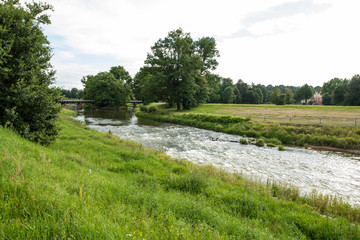 Fototapeta na wymiar Park with a flowing river