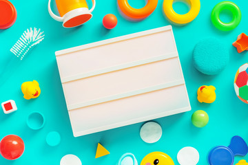 Flat lay lightbox as copy space with baby accessories