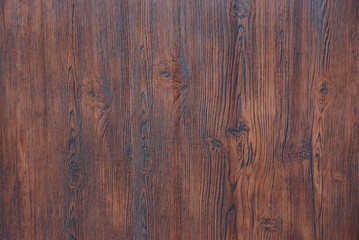 brown wooden background of dry boards in the wall of the fence