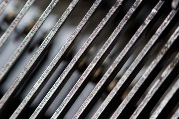 Hammers with letters, numbers and punctuation. Internal structure of the old Soviet typewriter close-up