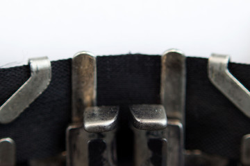 Old soviet typewriter close up. Filled in it blank sheet of paper without words. Macro.