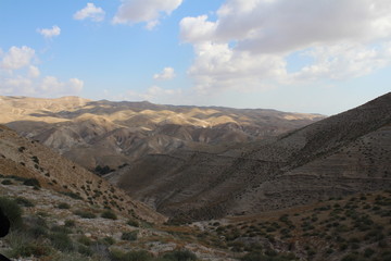 Fototapeta na wymiar Wadi Qelt in Judean desert near Jericho, nature, stone, rock and oasis. Unseen, unknown, unexplored places, hidden travel destinations, Israel
