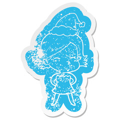 cartoon distressed sticker of a woman wearing santa hat