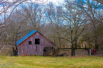 old barn in field