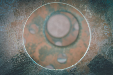 Excentric circles on a pile with rusty metallic texture in San Pedro de Atacama, Chile