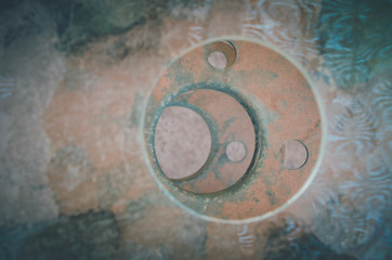 Excentric circles on a pile with rusty metallic texture in San Pedro de Atacama, Chile