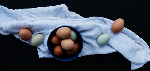 Natural free range chicken eggs on kitchen towel for food concept cooking banner.