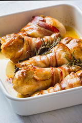 roasted bacon wrapped chicken legs