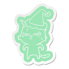 tough cartoon  sticker of a cat wearing santa hat