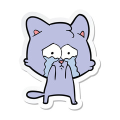 sticker of a cartoon crying cat