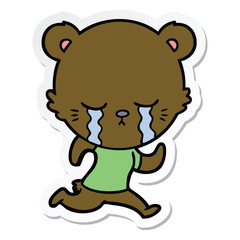 sticker of a crying cartoon bear running