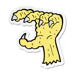 sticker of a cartoon bird claw
