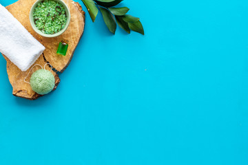 herbal cosmetic set for homemade spa on blue background top view space for text