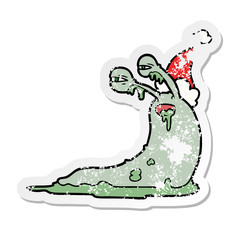 gross distressed sticker cartoon of a slug wearing santa hat