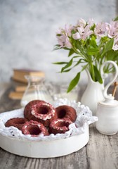 Fototapeta na wymiar Fresh baked red velvet cupcake on wooden table