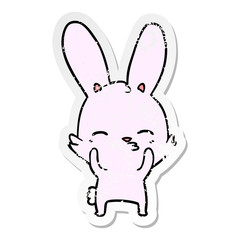 distressed sticker of a curious waving bunny cartoon
