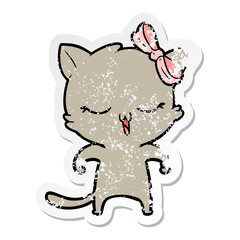 distressed sticker of a cartoon cat with bow on head