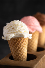 A Line of Three Classic Flavors of Ice Cream in a Wooden Sugar Mold