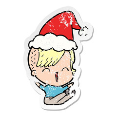 distressed sticker cartoon of a happy hipster girl wearing santa hat